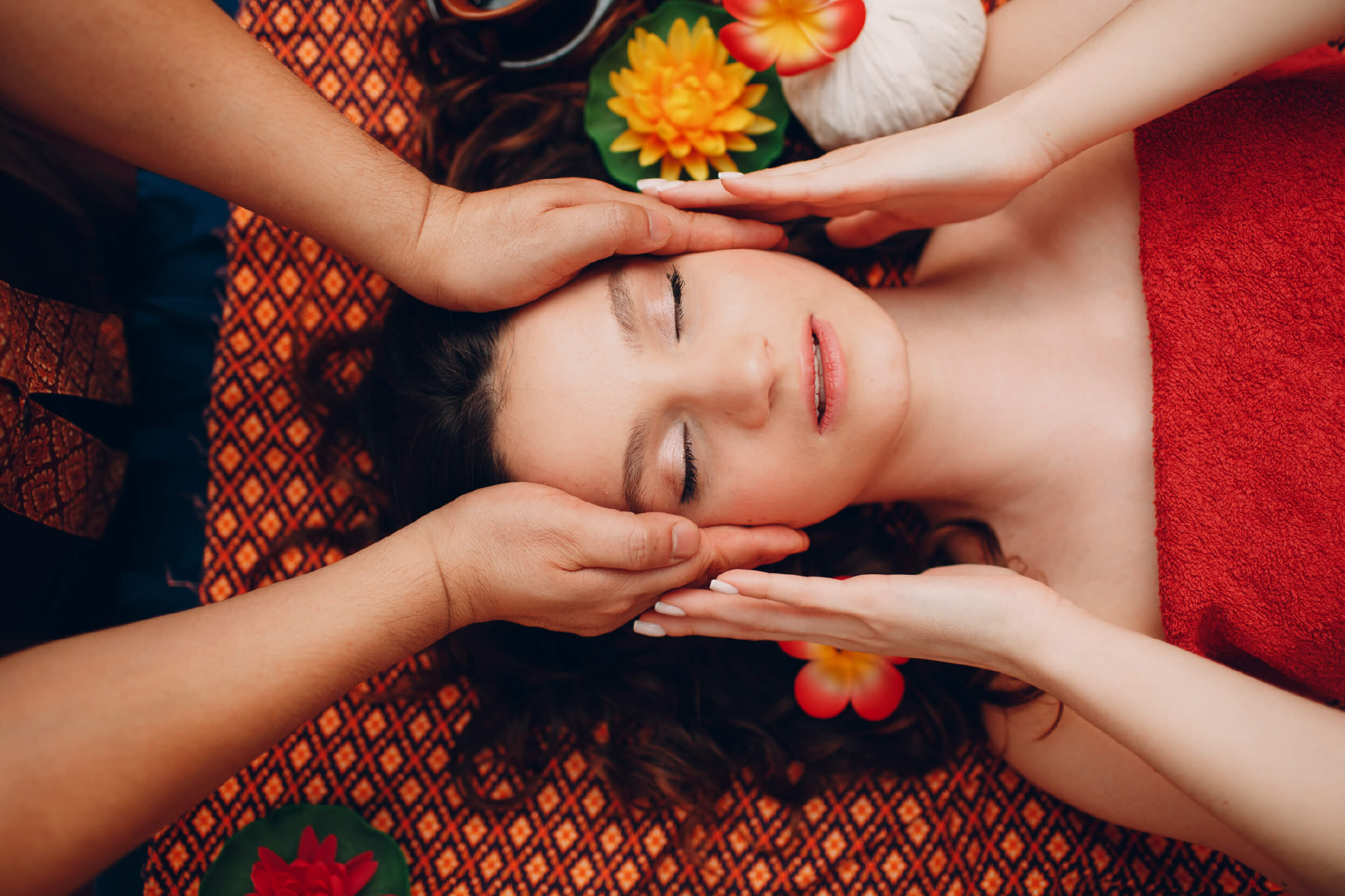 Thai man making classical thai massage procedure young woman beauty spa salon top view